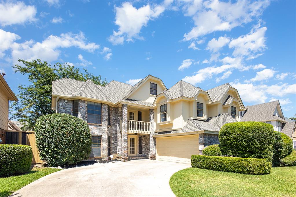 6029 Buffridge Trail Dallas, TX 75252 - Photo 2 of 30 a front view of a house with a garden