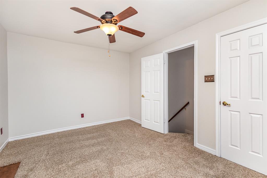 6029 Buffridge Trail Dallas, TX 75252 - Photo 21 of 30 an empty room with closet and fan