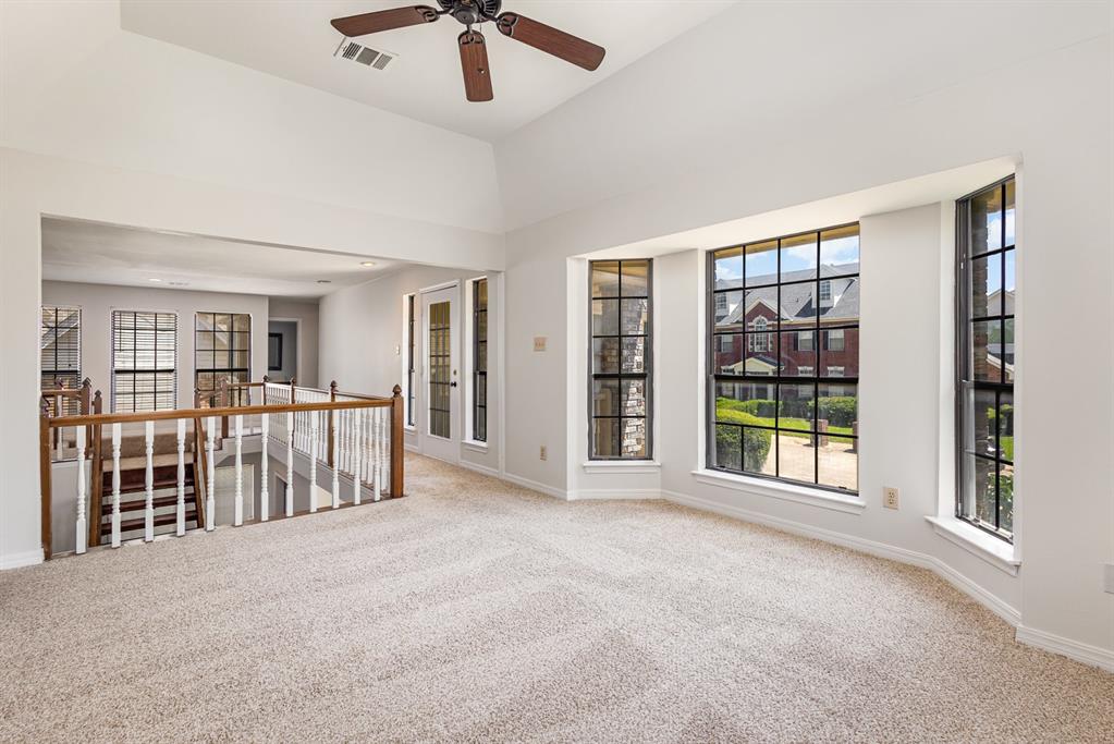 6029 Buffridge Trail Dallas, TX 75252 - Photo 23 of 30 a view of an empty room with furniture and a large window