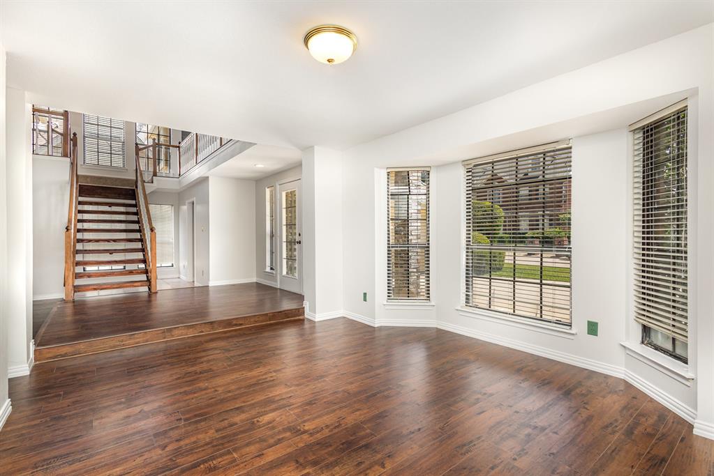 6029 Buffridge Trail Dallas, TX 75252 - Photo 8 of 30 wooden floor in an empty room with a window