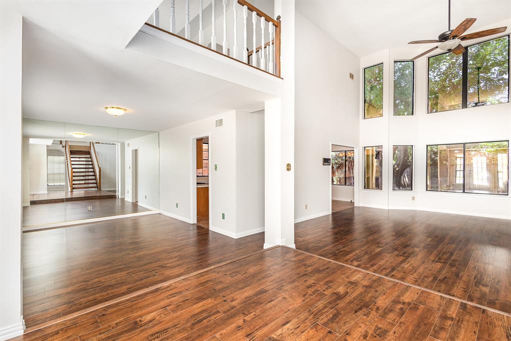 6029 Buffridge Trail Dallas, TX 75252 - Photo 9 of 30 a view of an entryway with wooden floor