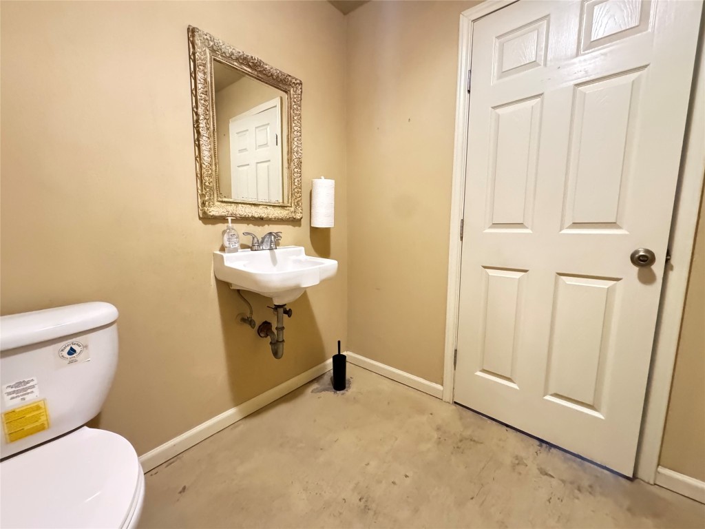 51 New Wehdem Road Brenham, TX 77833 - Photo 8 of 20 a bathroom with a sink a toilet and mirror