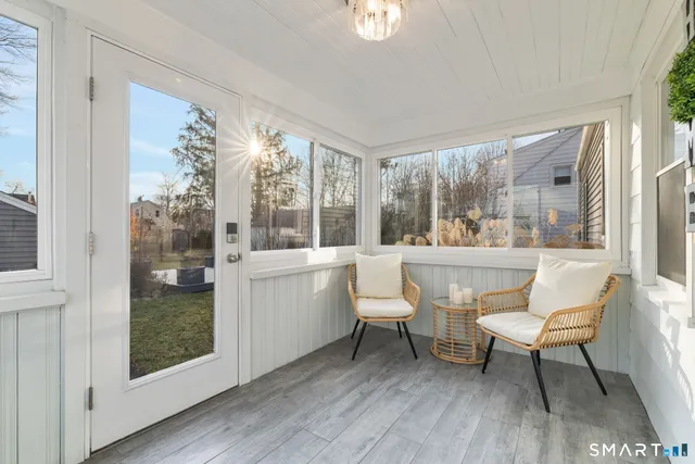 a view of a house with a backyard and trees