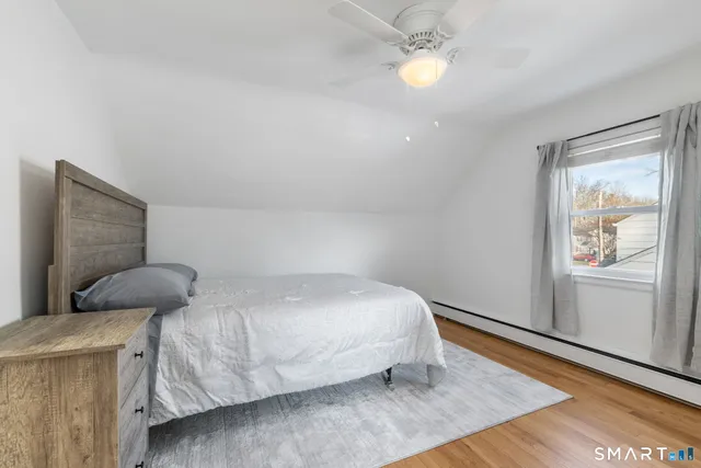 a view of a dresser and wooden floor