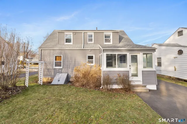 a view of a house with snow on the side of the house