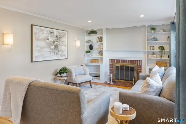 a living room with furniture and a fireplace