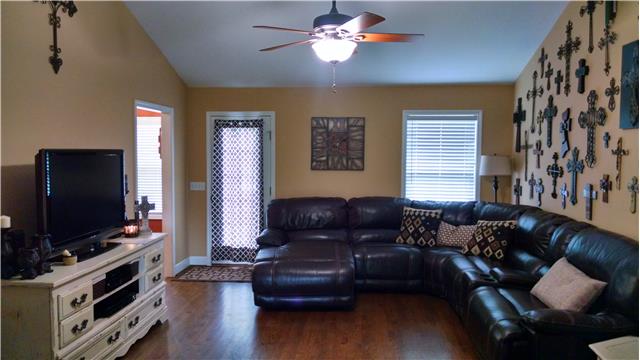 6778 Primm Springs Road Lyles, TN 37098 - Photo 6 of 20 Vaulted ceiling and hardwood floor in the living room ~ Warm neutral paint colors