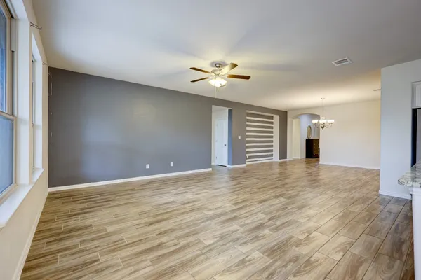 a view of kitchen with sink and refrigerator