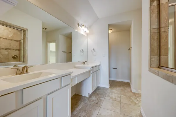 an empty room with a empty space and a ceiling fan