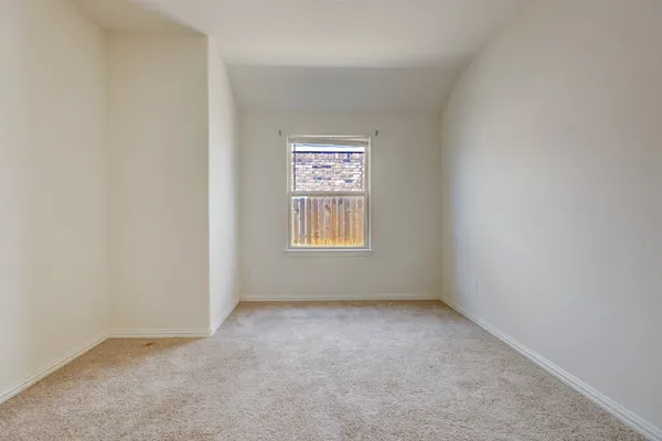 a bathroom with a double vanity sink mirror and next to a window