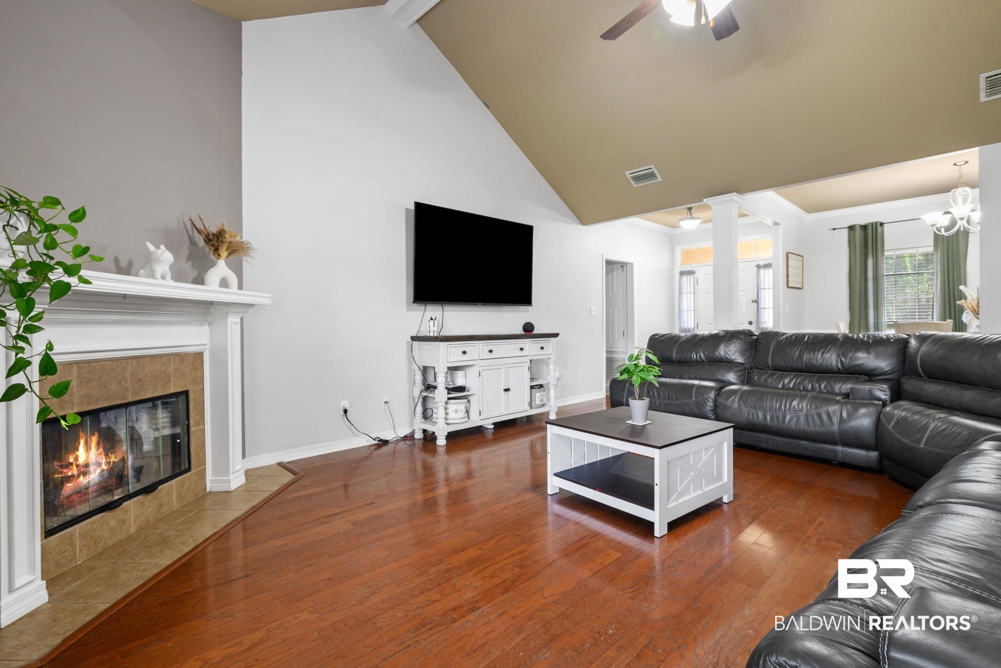 9422 Labrador Run South Mobile, AL 36695 - Photo 8 of 36 Living room featuring rich wood-finish flooring and a vaulted ceiling