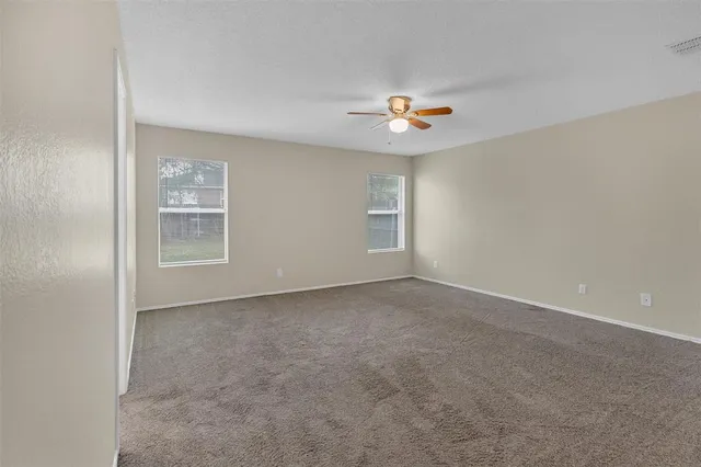 a view of empty room with windows