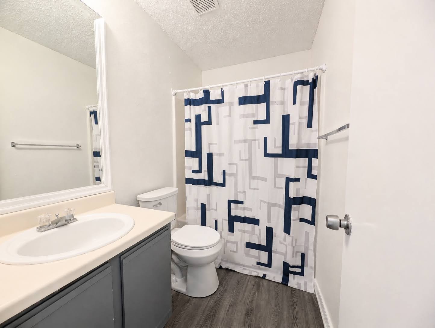 2036 Redwing Way Round Rock, TX 78664 - Photo 12 of 23 Guest bathroom
A compact and efficient bathroom features a shower, toilet, and vanity with a mirror.