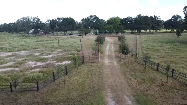 a view of a lake with a yard and mountain view