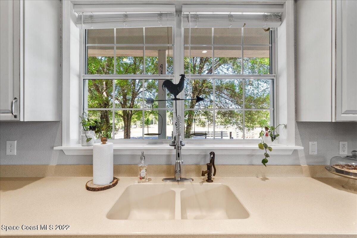 4450 Rayburn Road Cocoa, FL 32926 - Photo 12 of 45 a kitchen with a sink and a large window