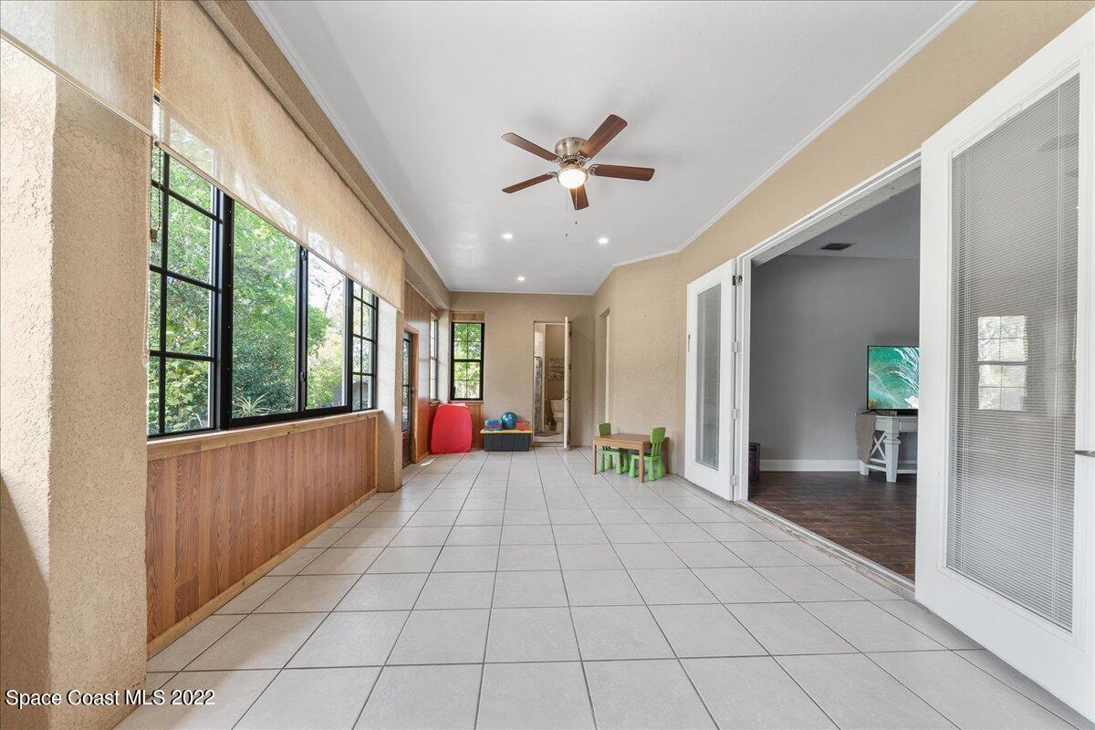 4450 Rayburn Road Cocoa, FL 32926 - Photo 26 of 45 a view of an entryway with a chandelier