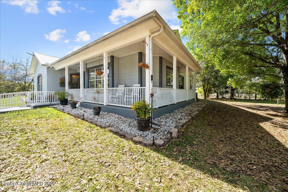 4450 Rayburn Road Cocoa, FL 32926 - Photo 3 of 45 a front view of a house with a garden
