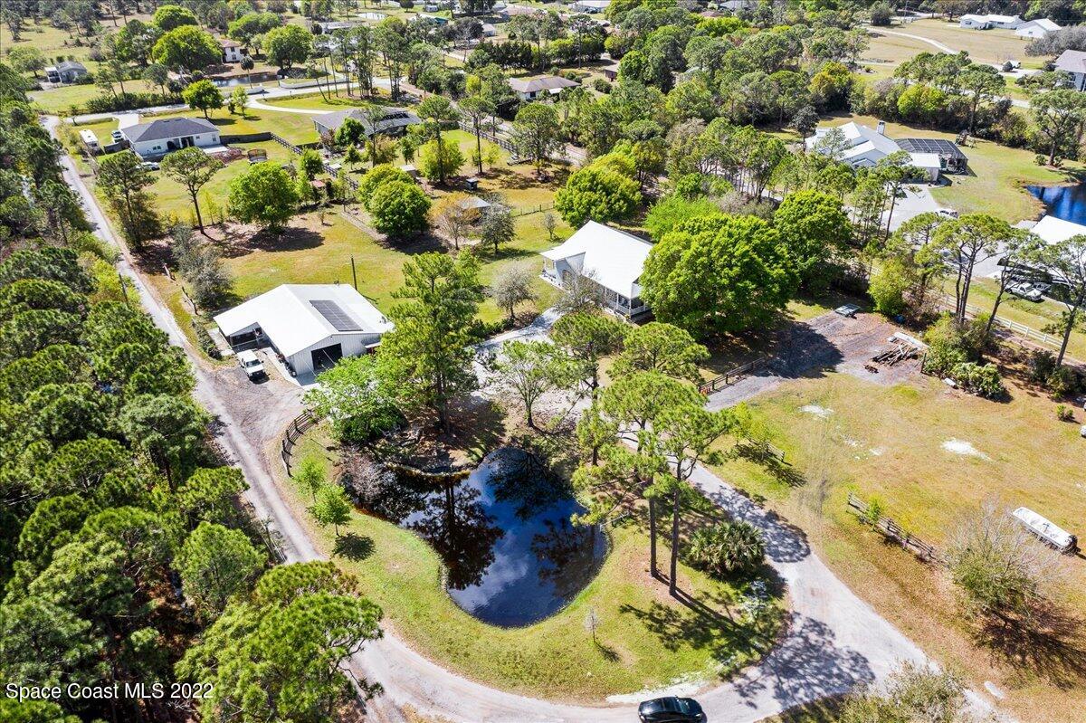 4450 Rayburn Road Cocoa, FL 32926 - Photo 39 of 45 a view of residential houses with swimming pool