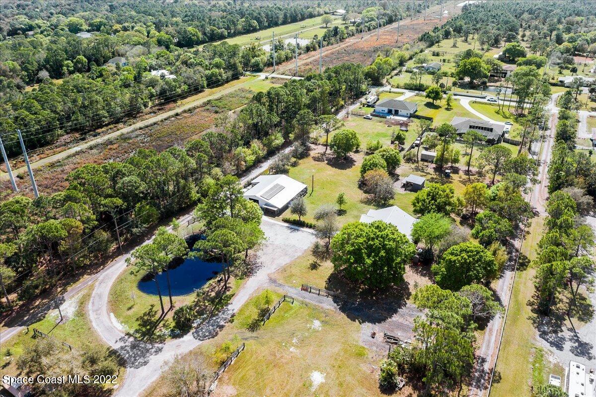 4450 Rayburn Road Cocoa, FL 32926 - Photo 40 of 45 a view of a garden with a lot of flowers