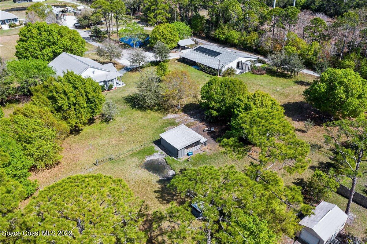 4450 Rayburn Road Cocoa, FL 32926 - Photo 44 of 45 an aerial view of a house with a yard