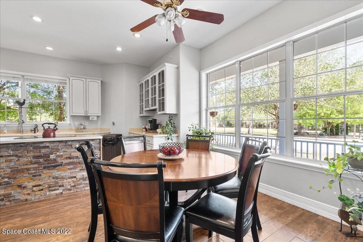 4450 Rayburn Road Cocoa, FL 32926 - Photo 9 of 45 a view of a dining room with furniture window and outside view