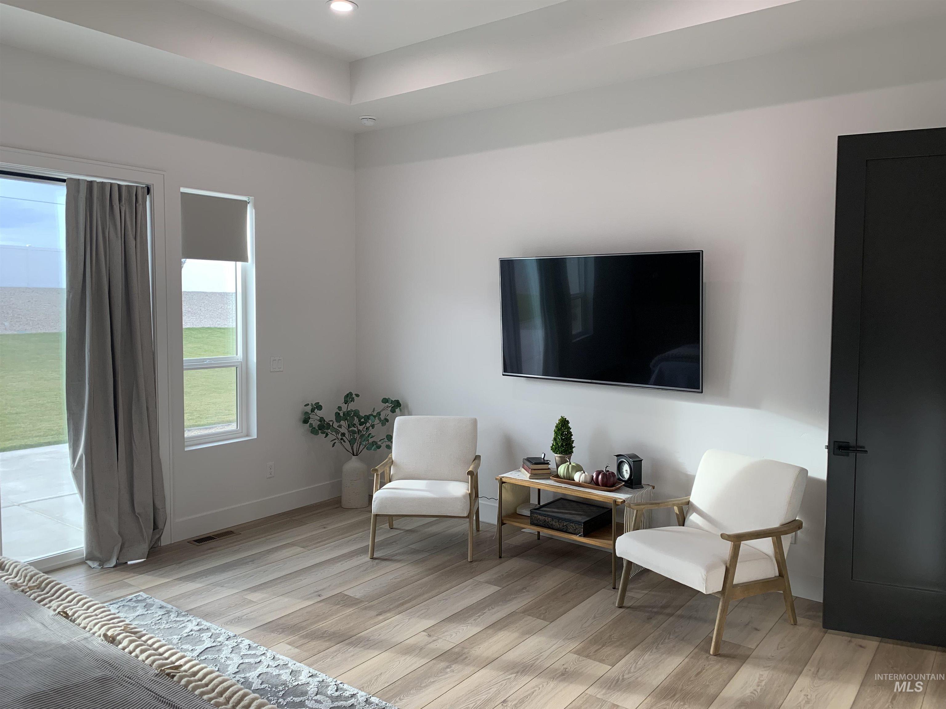 24501 Himark Way Caldwell, ID 83607 - Photo 13 of 27 Living area with light wood finished floors and recessed lighting