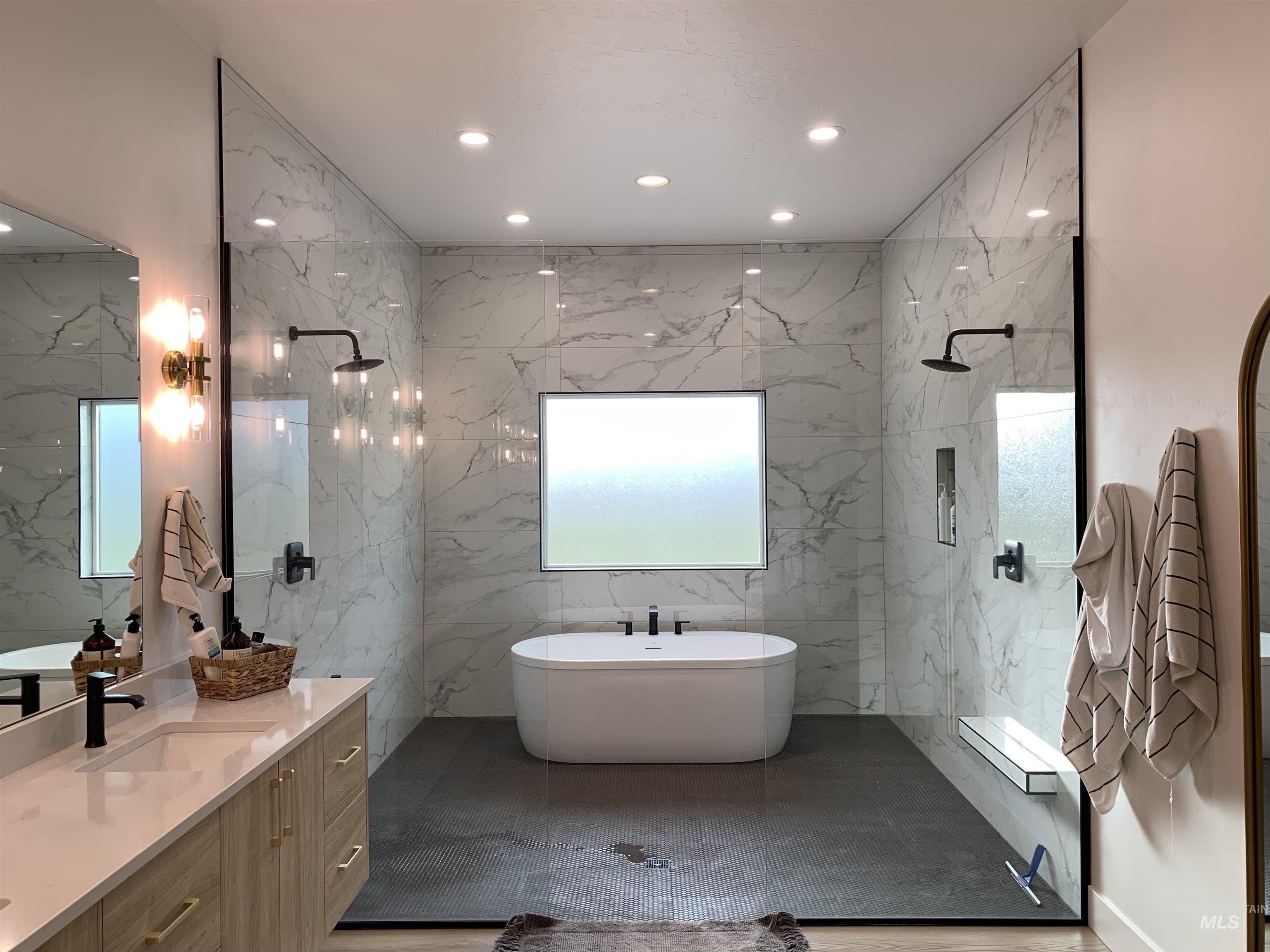 24501 Himark Way Caldwell, ID 83607 - Photo 15 of 27 Full bath with vanity, recessed lighting, a freestanding bath, and a marble finish shower