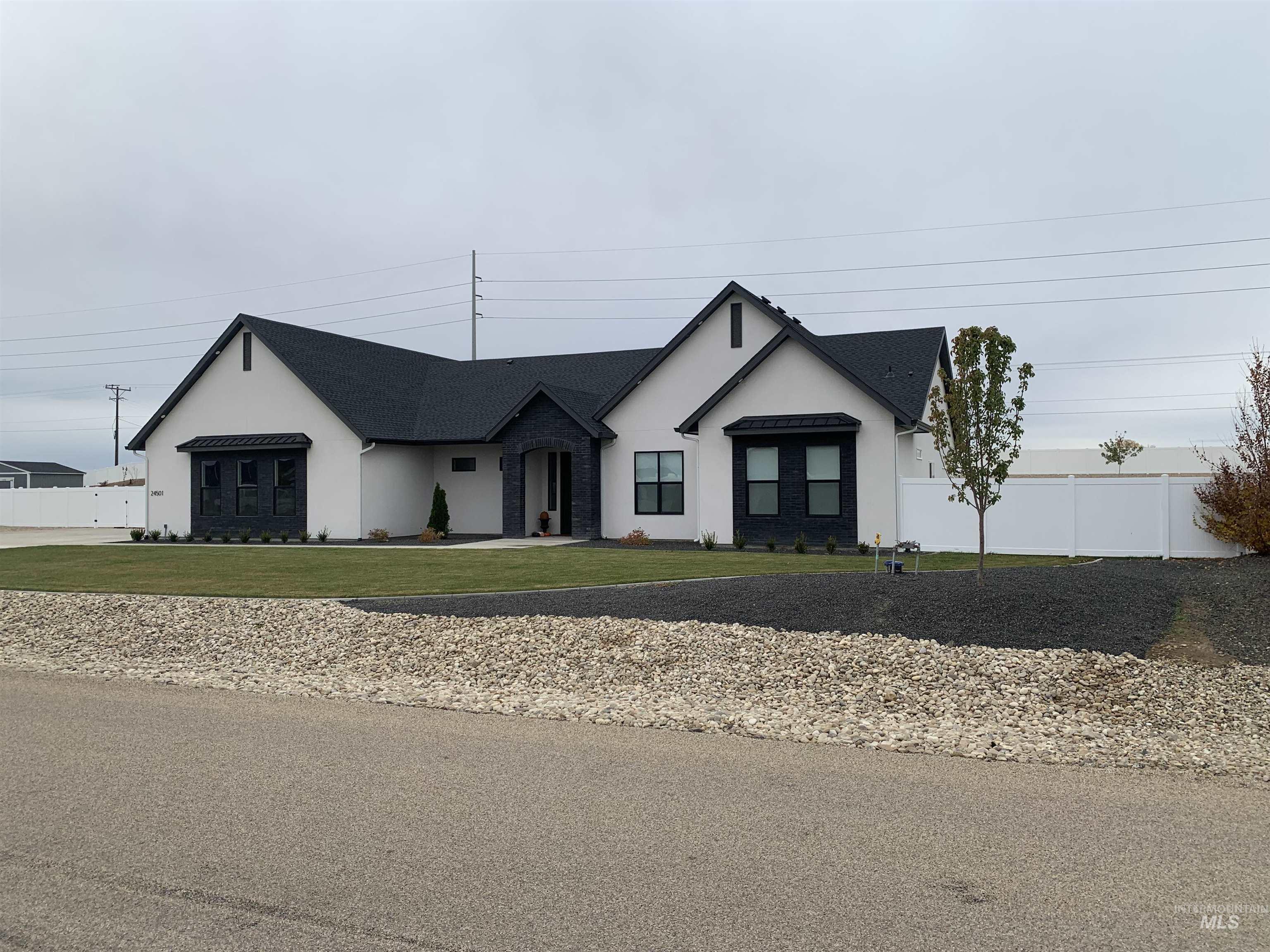 24501 Himark Way Caldwell, ID 83607 - Photo 2 of 27 View of front of house with stucco siding