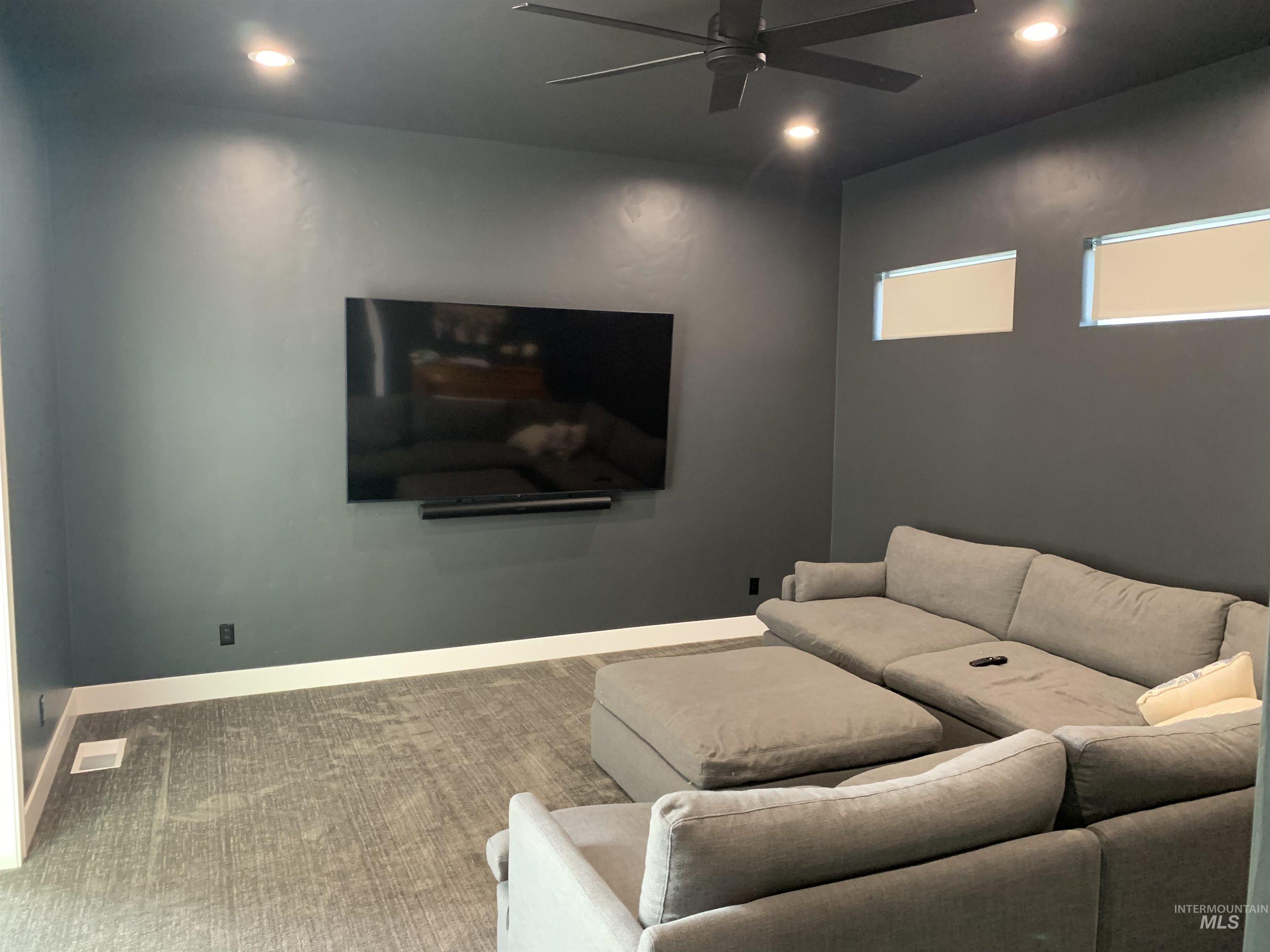24501 Himark Way Caldwell, ID 83607 - Photo 24 of 27 Carpeted cinema with ceiling fan and recessed lighting
