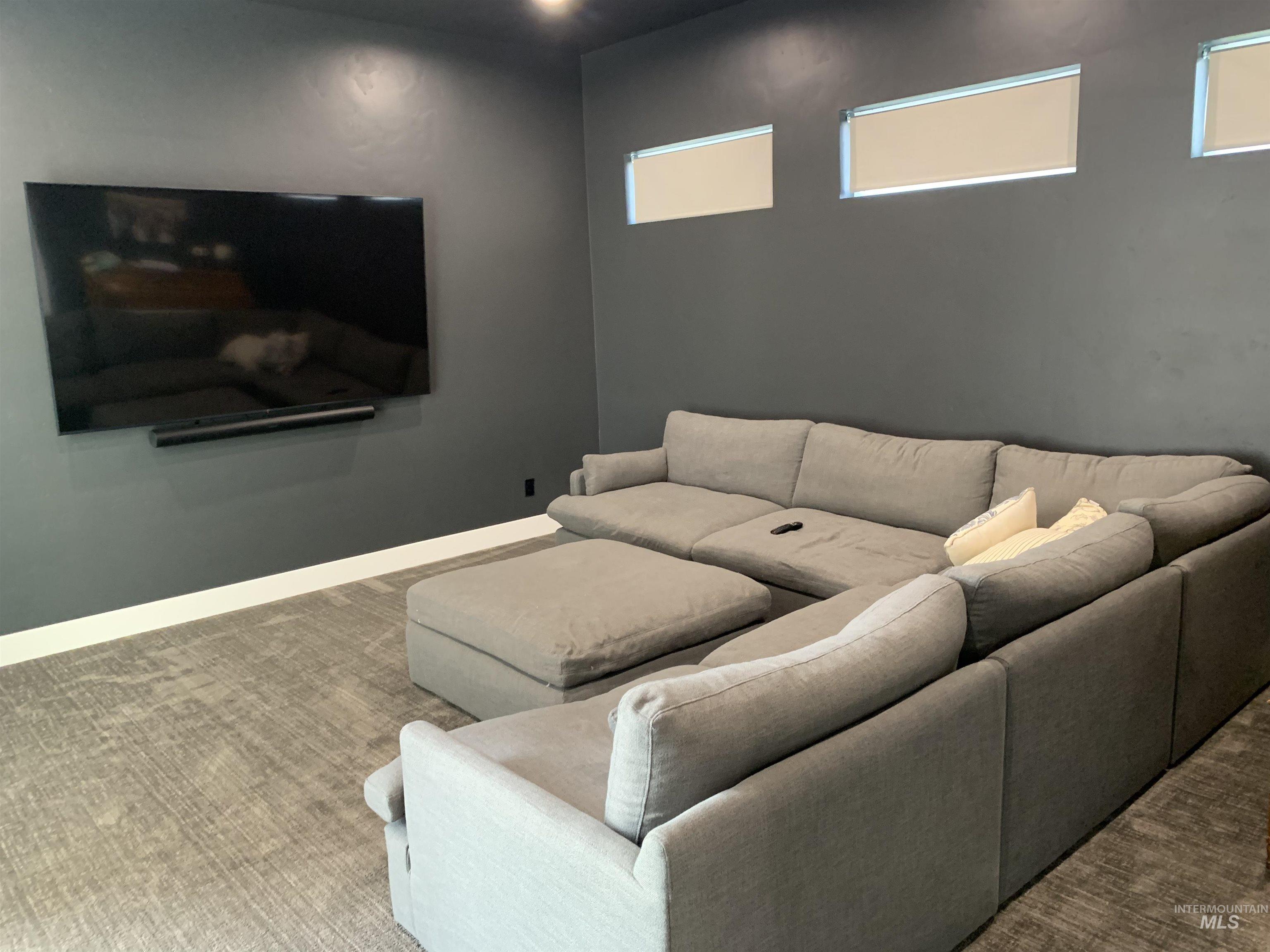 24501 Himark Way Caldwell, ID 83607 - Photo 25 of 27 Carpeted home theater room with baseboards