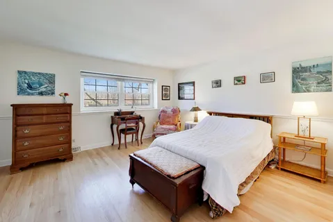 a bed room with a bed and a table