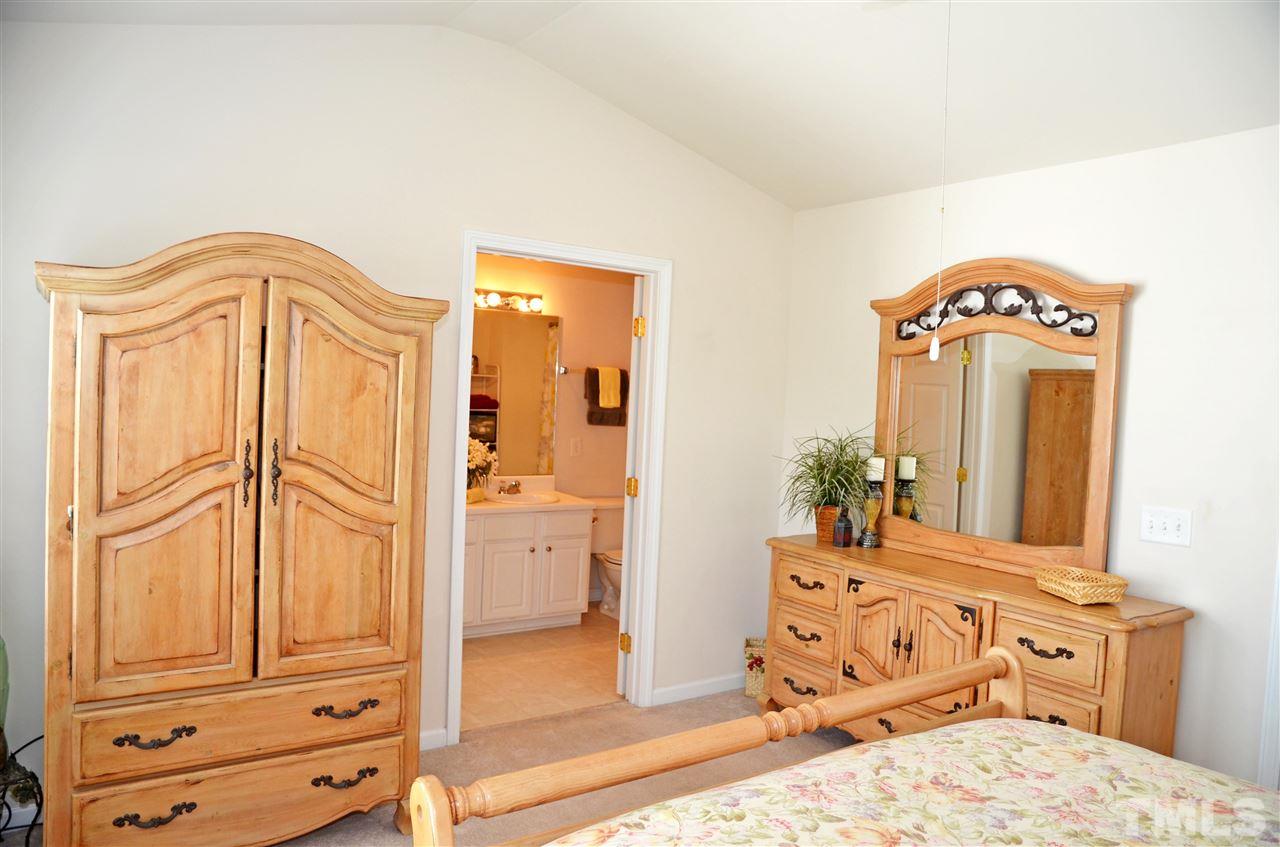 8520 Silhouette Place Raleigh, NC 27613 - Photo 14 of 17 wooden floor to ceiling window and a mirror