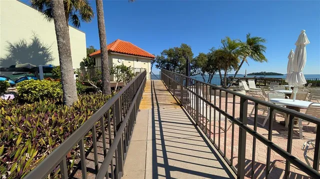 a view of a swimming pool with a table and chairs