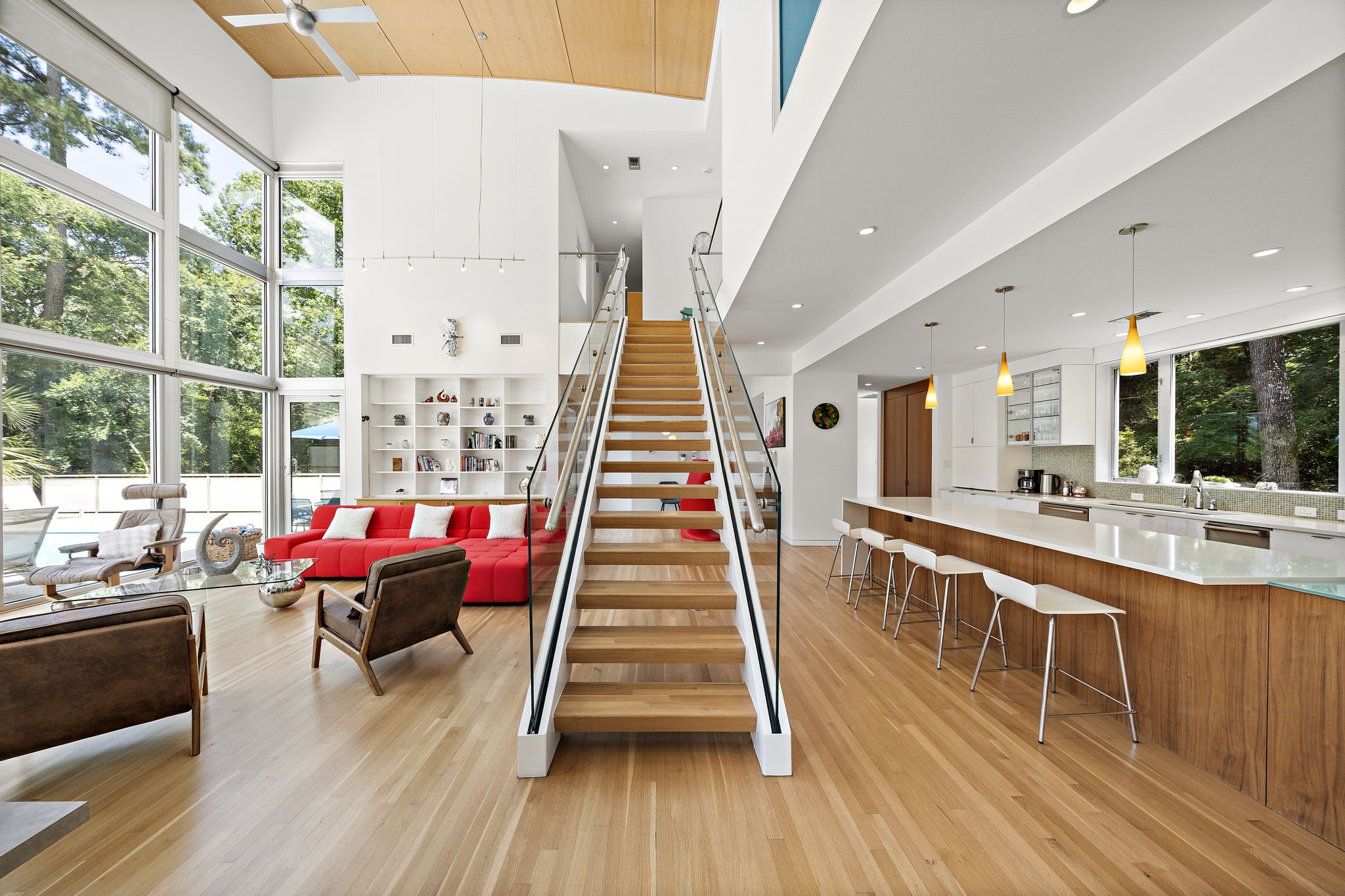 Flowing layout connects living and dining with views of the backyard oasis.
