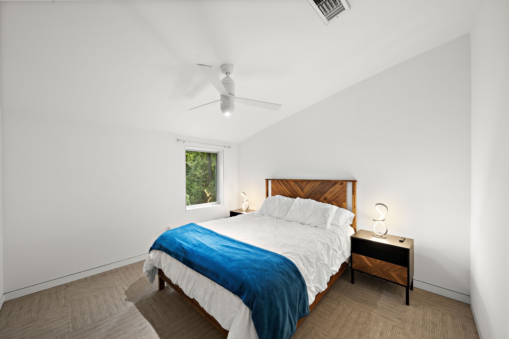 118 Angel Leaf Road Spring, TX 77380 - Photo 23 of 50 Comfortable secondary bedroom with ceiling fan and ample natural light.