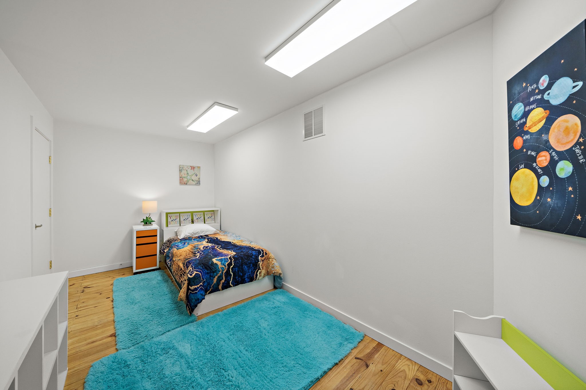 118 Angel Leaf Road Spring, TX 77380 - Photo 28 of 50 Colorful secondary bedroom with whimsical decor and built-in shelving.