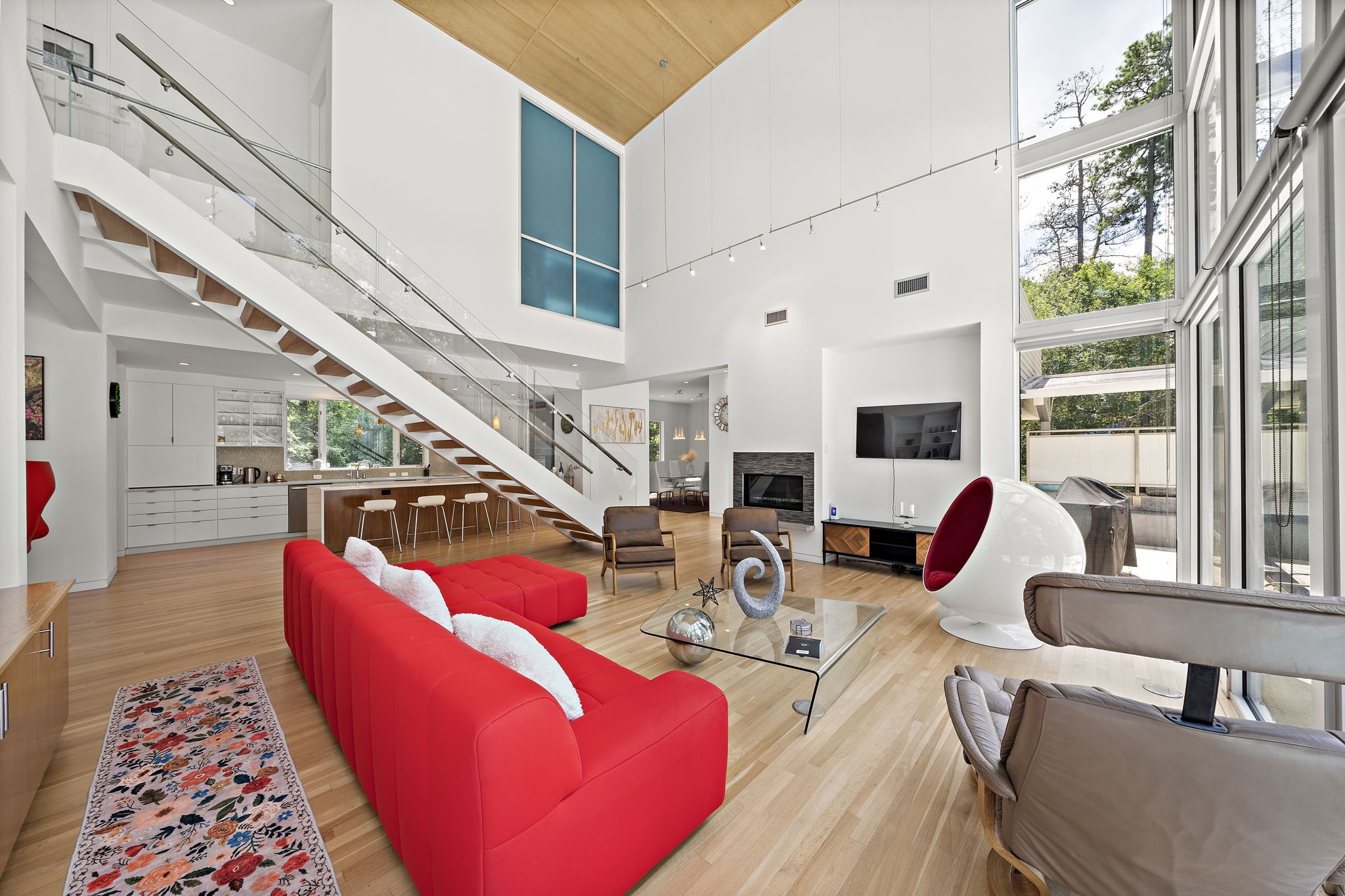 118 Angel Leaf Road Spring, TX 77380 - Photo 4 of 50 Inviting family room with tall ceilings and sleek hardwood flooring.