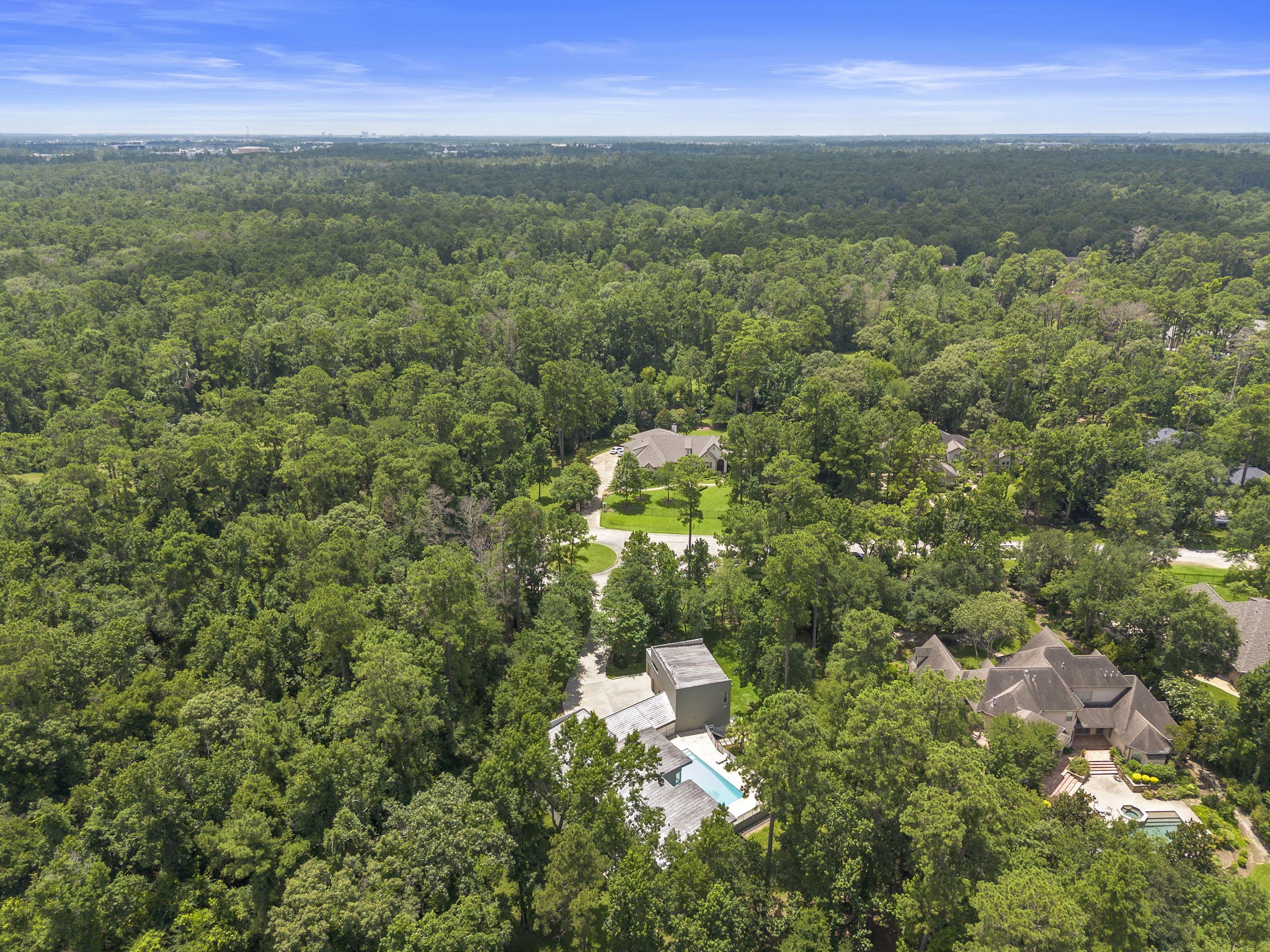 118 Angel Leaf Road Spring, TX 77380 - Photo 47 of 50 Bird’s-eye view of home, pool, and tree-filled lot.