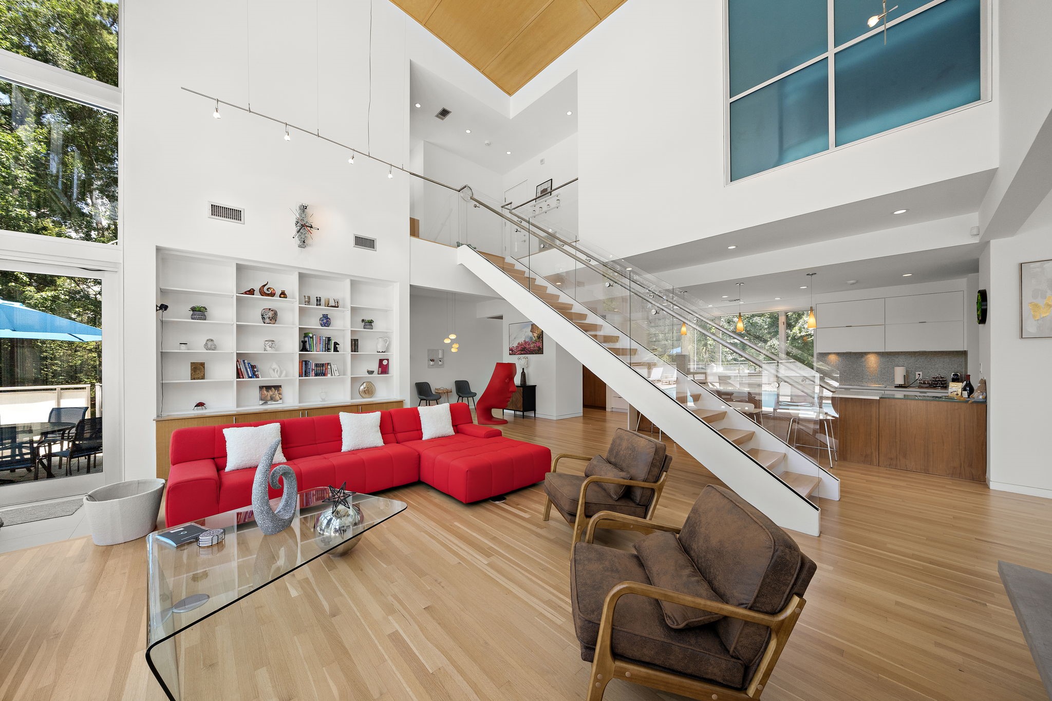 118 Angel Leaf Road Spring, TX 77380 - Photo 6 of 50 Inviting family room with tall ceilings and sleek hardwood flooring.