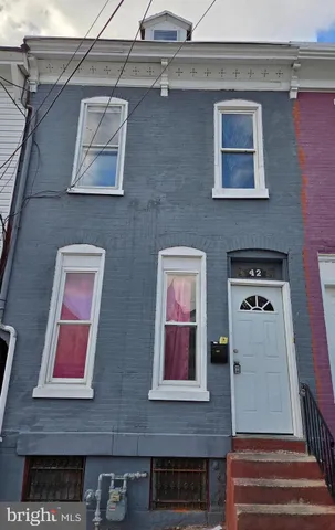 a front view of a building with glass windows