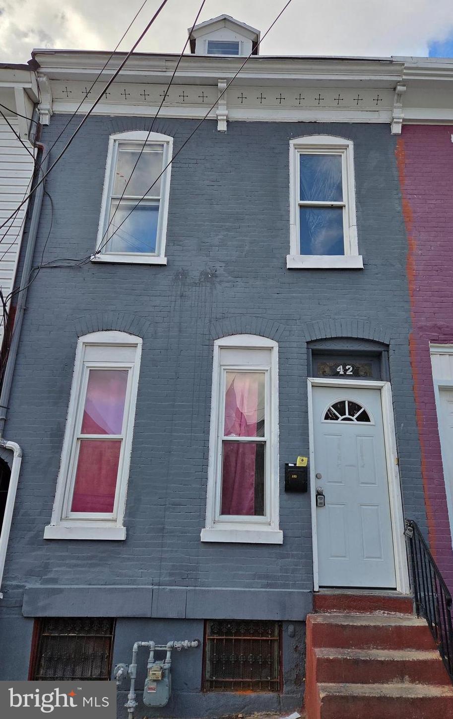 42 Maple Street Reading, PA 19602 - Photo 1 of 21 a front view of a building with glass windows