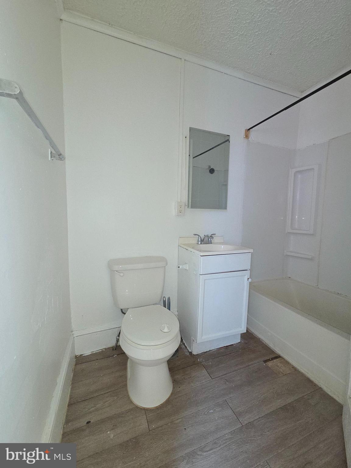 42 Maple Street Reading, PA 19602 - Photo 11 of 18 a white toilet sitting next to a bathroom sink