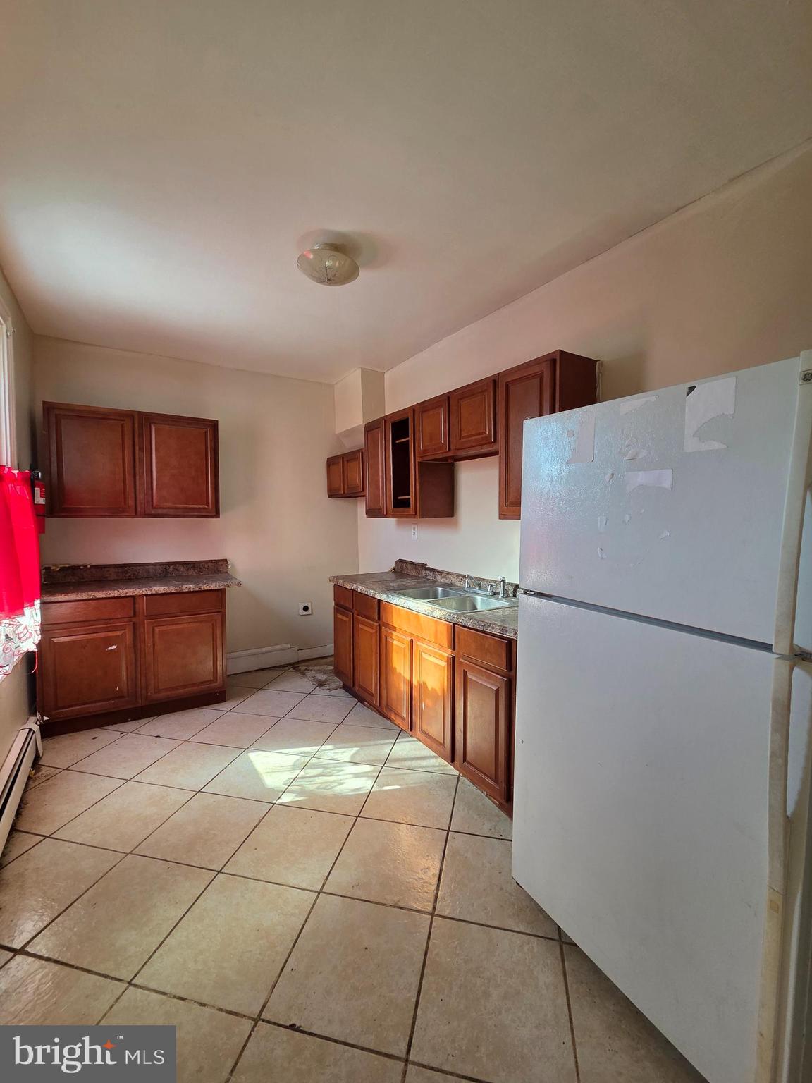 42 Maple Street Reading, PA 19602 - Photo 8 of 18 a kitchen with stainless steel appliances a refrigerator and a sink