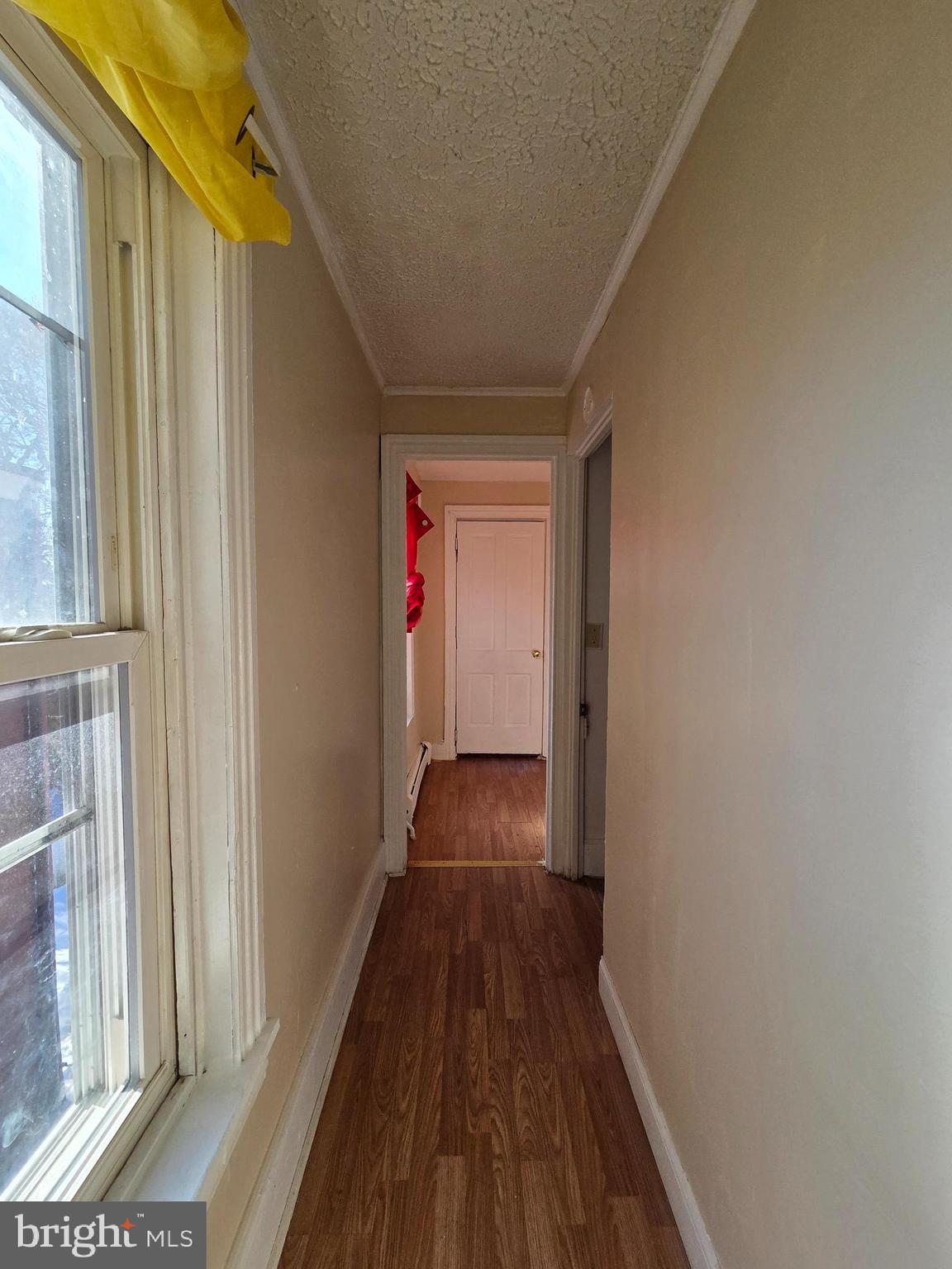42 Maple Street Reading, PA 19602 - Photo 10 of 18 a view of a hallway with wooden floor and staircase
