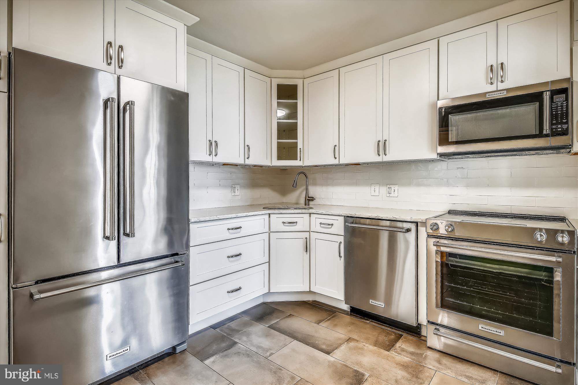 6800 Fleetwood Road, Unit 1004 McLean, VA 22101 - Photo 6 of 40 Sleek modern kitchen with stainless appliances.
