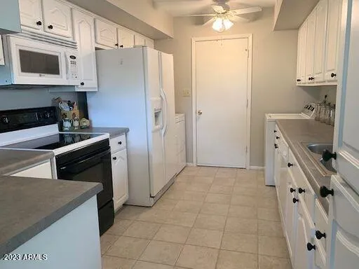 a kitchen with stainless steel appliances a stove microwave and a refrigerator