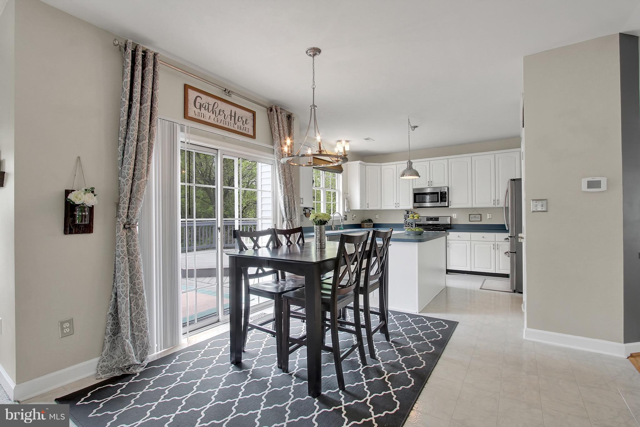 5056 Springhouse Circle Baltimore, MD 21236 - Photo 7 of 22 Kitchen Table Space with Access to Private Deck