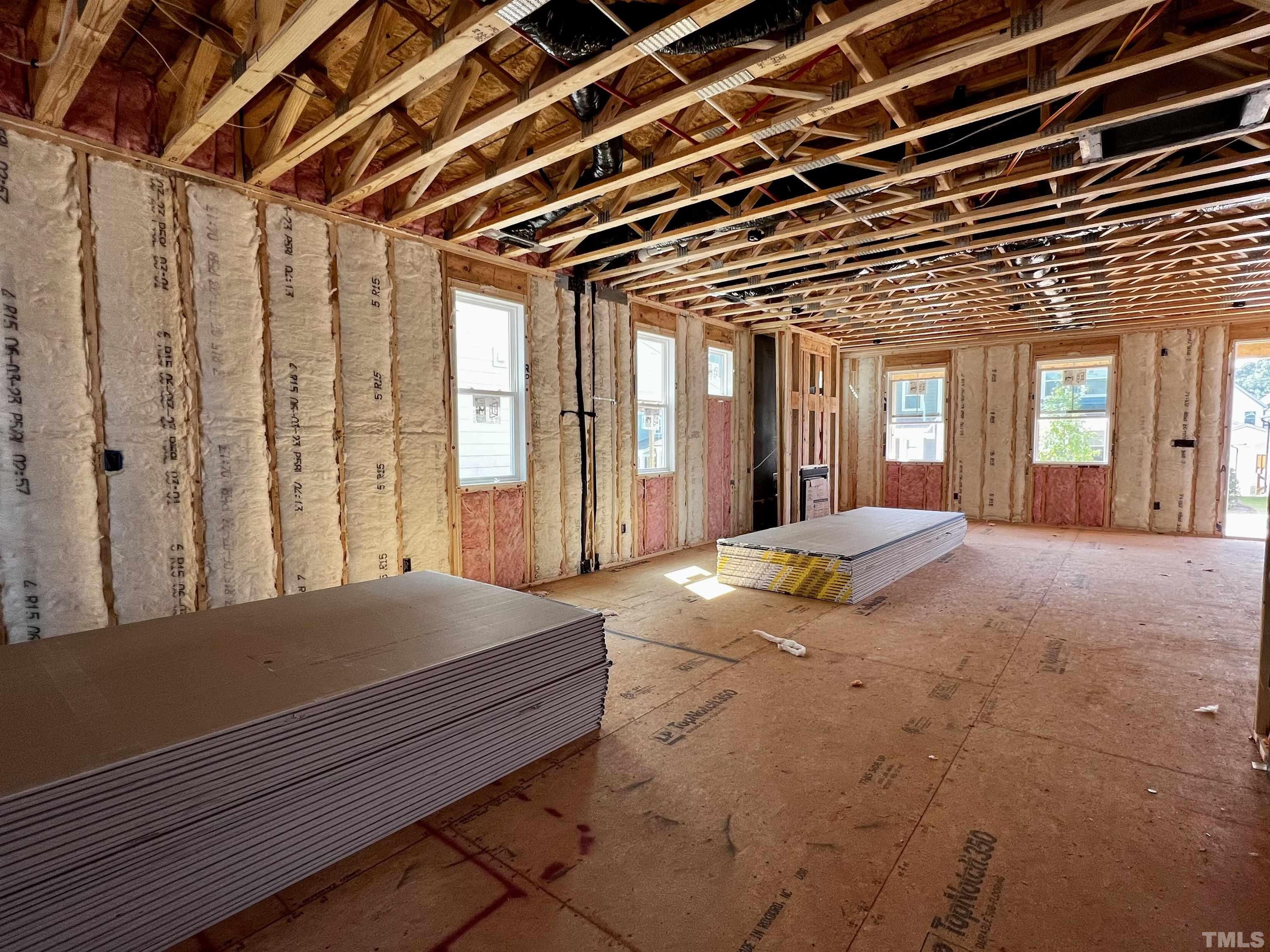 517 Friendship Chapel Road, Unit HVA0055 Wake Forest, NC 27587 - Photo 12 of 58 a spacious bedroom with a large bed and large windows