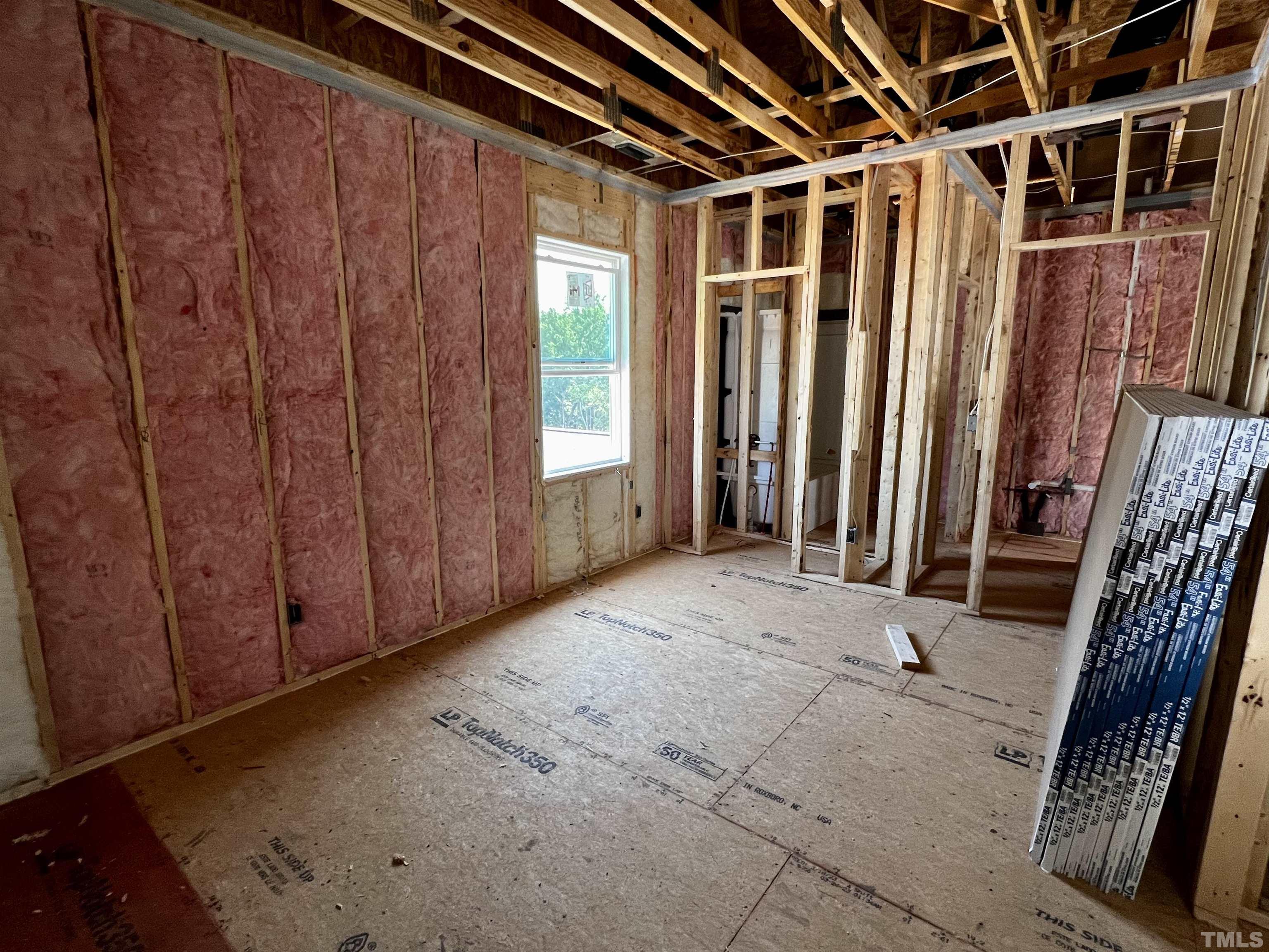 517 Friendship Chapel Road, Unit HVA0055 Wake Forest, NC 27587 - Photo 18 of 58 a view of an empty room with wooden walls