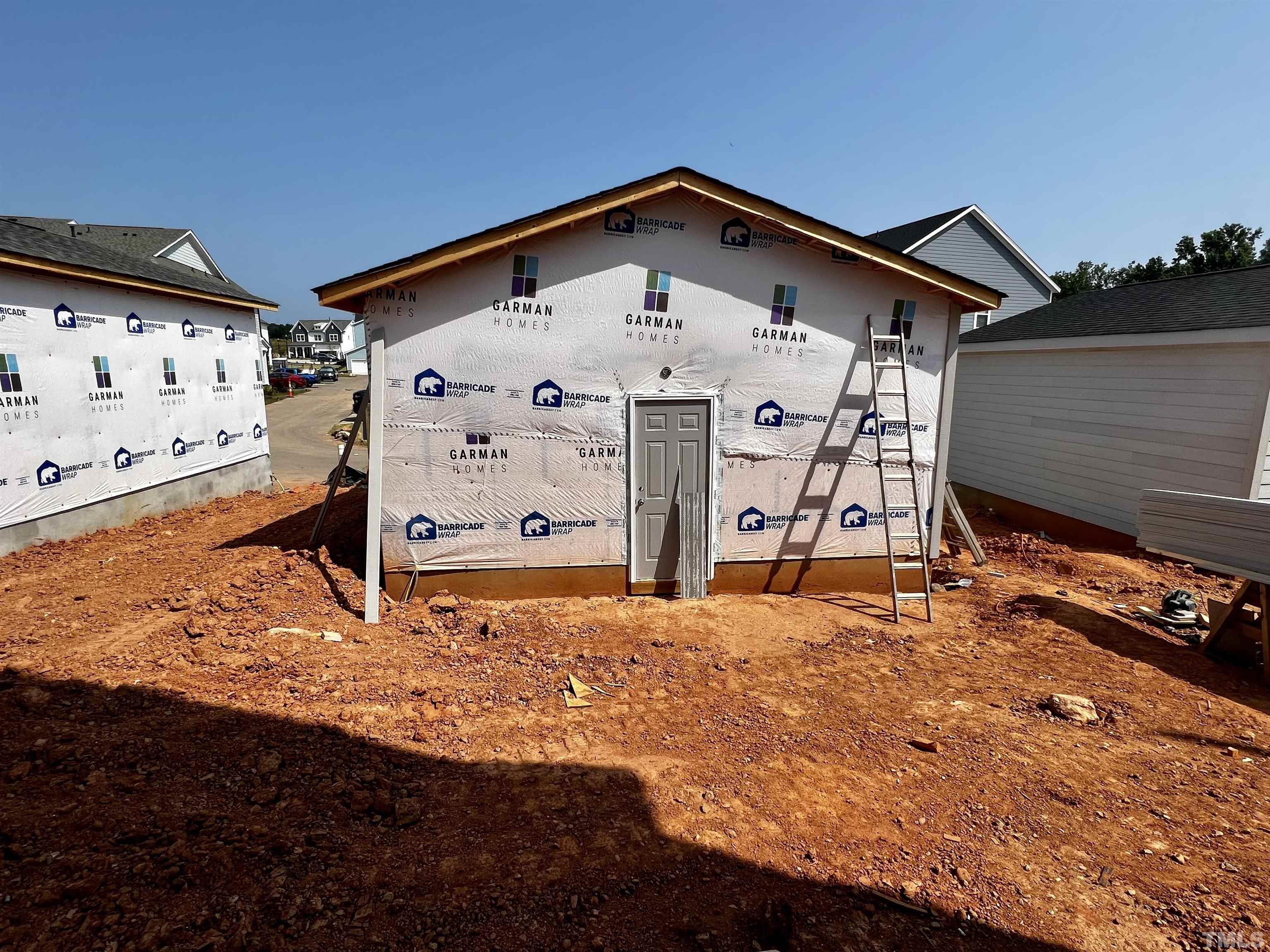 517 Friendship Chapel Road, Unit HVA0055 Wake Forest, NC 27587 - Photo 26 of 58 a front view of a house with garage
